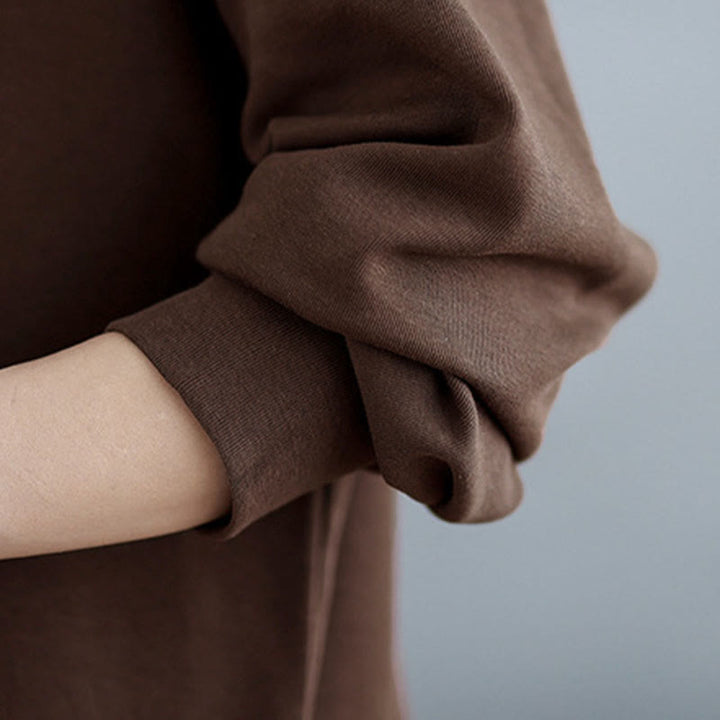 Bluza damska z bawełny z okrągłym dekoltem i długim rękawem w jednolitym kolorze i asymetrycznym wzorem "Buddha Stones Fall" - image 11