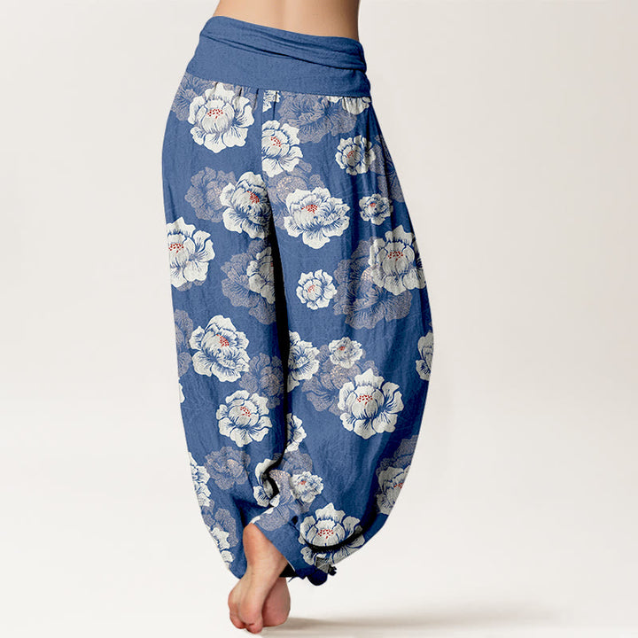 Eleganckie, damskie spodnie haremowe z elastyczną talią i wzorem w białe kwiaty z motywem Buddha Stones - image 6