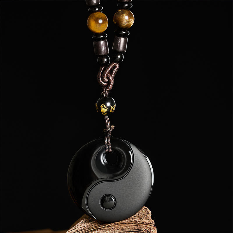 Buddha Stones Yin Yang z symbolem Om Mani Padme Hum i czarnym obsydianem. Wisiorek. - image 1