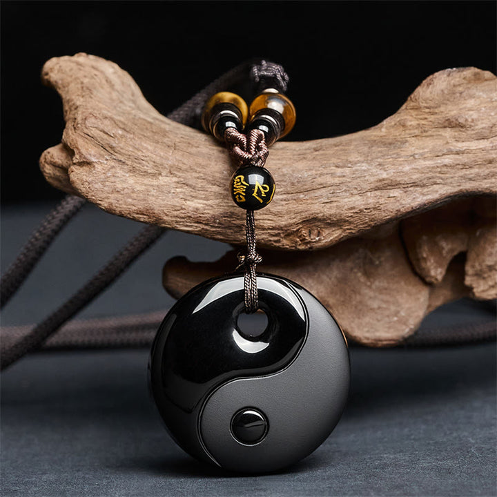Buddha Stones Yin Yang z symbolem Om Mani Padme Hum i czarnym obsydianem. Wisiorek. - Czarny obsydian (rozmiar wisiorka: 37*8 mm) - image 0