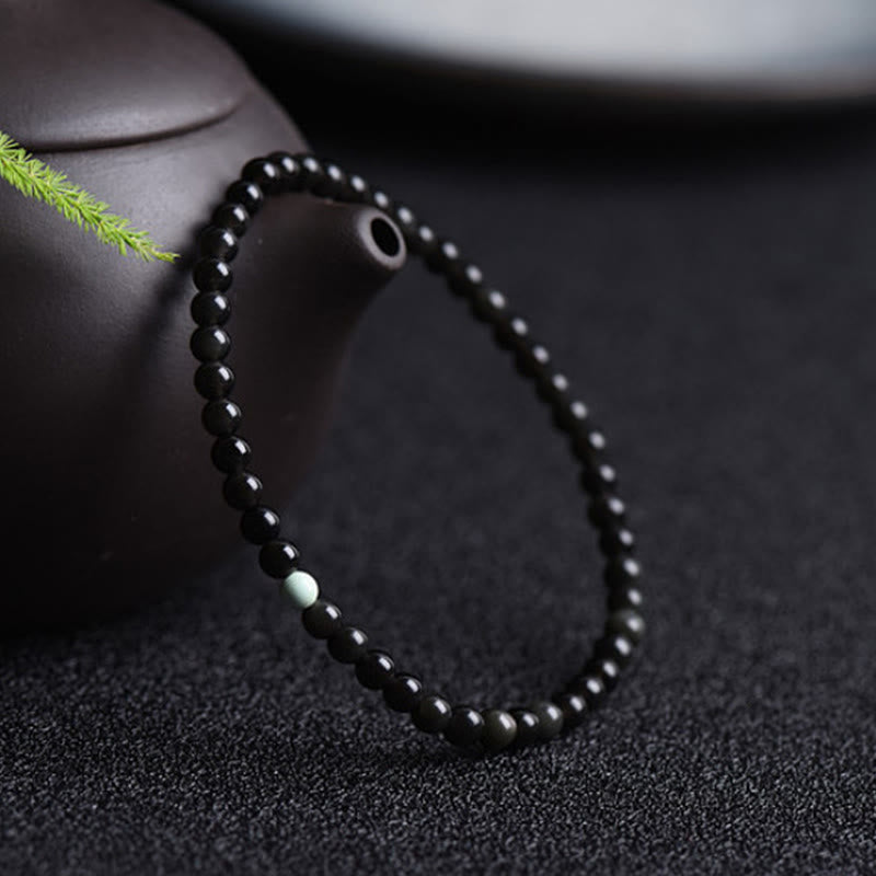 Bransoletka z Buddha Stones z czarnego obsydianu i turkusu, zapewniająca spełnienie siły - image 2