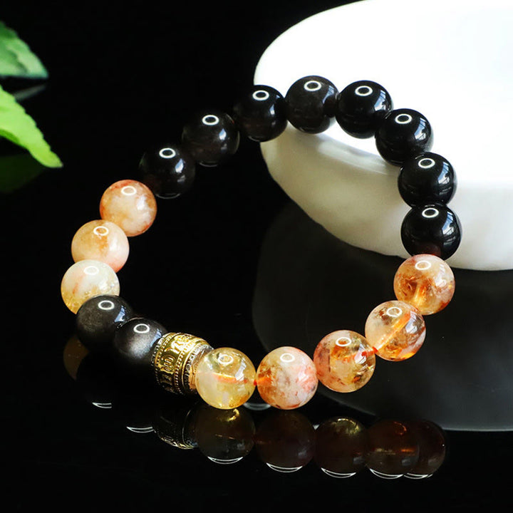 Bransoletka ochronna z Buddha Stones Om Mani Padme Hum w srebrnym połysku z obsydianem i cytrynem - image 1