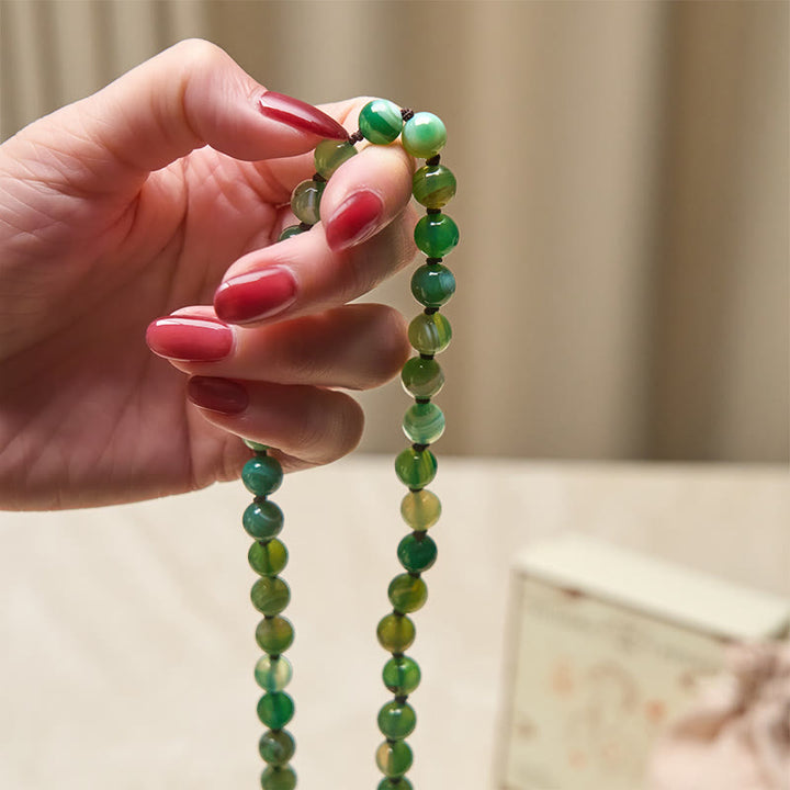Bransoletka ochronna z koralików i frędzli z malachitu z Buddha Stones - image 4