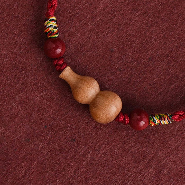 Bransoletka z regulowanym sznurkiem i Buddha Stones, tykwą i drewnem brzoskwiniowym, zapewniająca bogactwo i szczęście - image 1