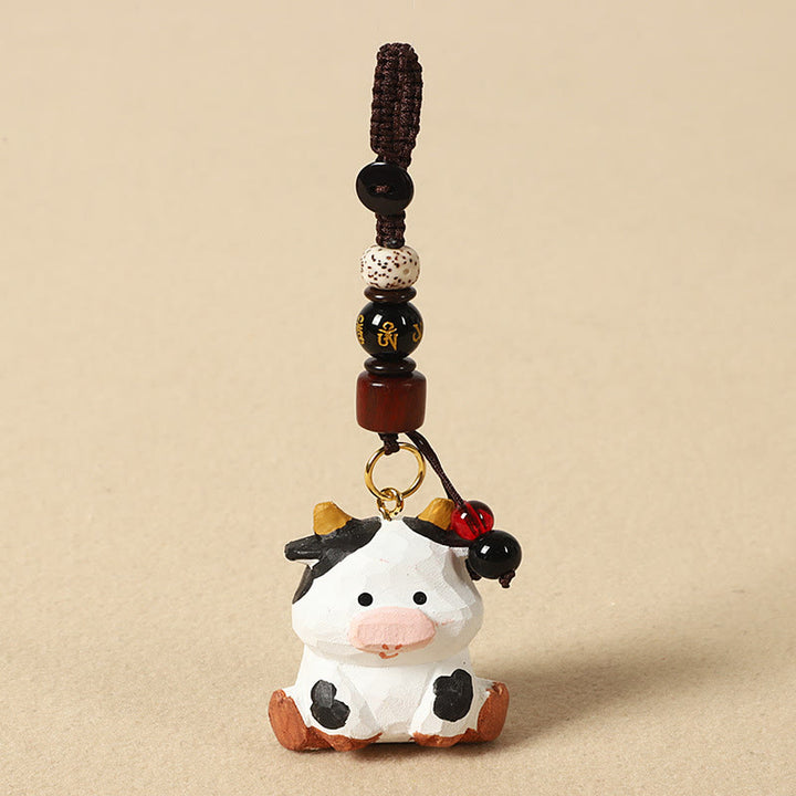 Buddha Stones Chiński breloczek z grawerunkiem z drewna lipowego i kwiatem śliwy, spokojem i bezpieczeństwem , Om Mani Padme Hum - Wół 4 cm (kolor, kształt i rozmiar mogą się różnić) - Om Mani Padme Hum - image 10