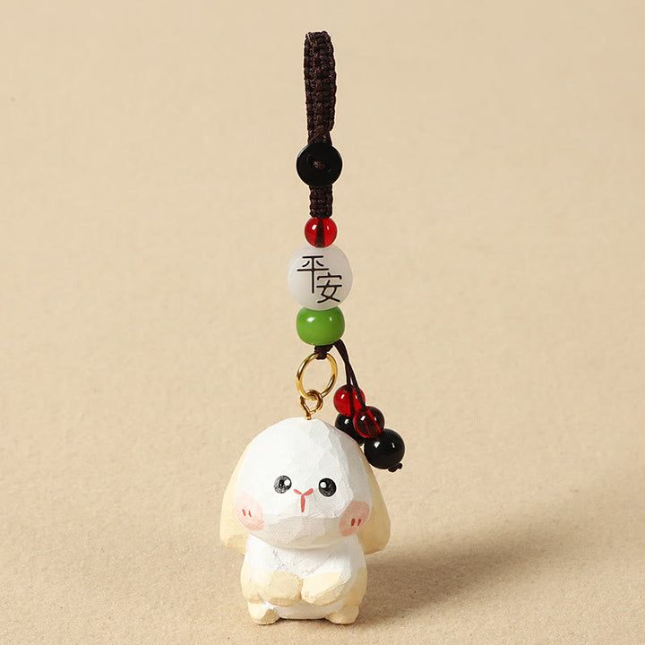 Buddha Stones Chiński breloczek z grawerunkiem z drewna lipowego i kwiatem śliwy, spokojem i bezpieczeństwem , Om Mani Padme Hum - Królik 4 cm (kolor, kształt i rozmiar mogą się różnić) - Pokój i bezpieczeństwo - image 18