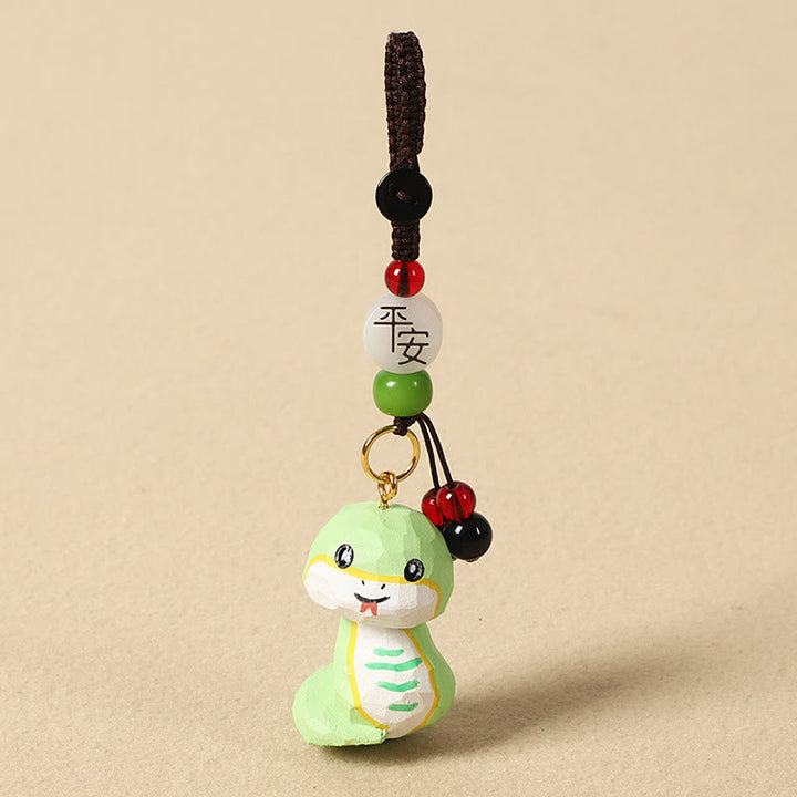 Buddha Stones Chiński breloczek z grawerunkiem z drewna lipowego i kwiatem śliwy, spokojem i bezpieczeństwem , Om Mani Padme Hum - Wąż 4 cm (kolor, kształt i rozmiar mogą się różnić) - Pokój i bezpieczeństwo - image 25