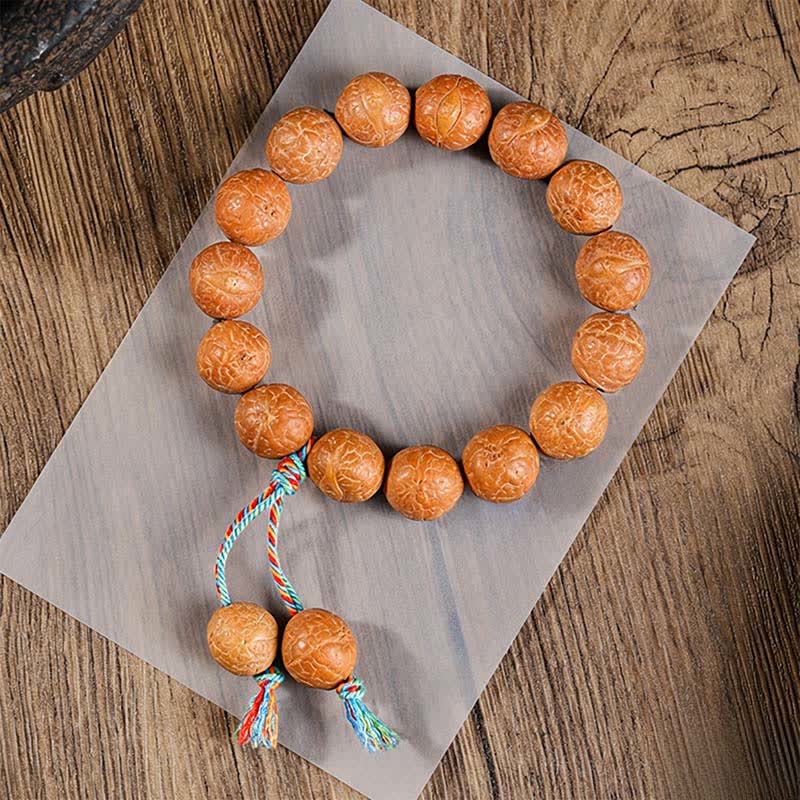 Buddha Stones Ręcznie rzeźbiona etniczna mala na nadgarstek z motywem mądrości Bodhi i oka feniksa - Charms na nadgarstek w kształcie oka feniksa - 15 mm - Oko Feniksa Bodhi (Ochrona ♥Mądrość) - image 0