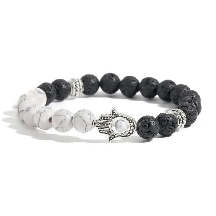 Buddha Stones Ręcznie wykonana okrągła bransoletka z ochroną dłoni Hamsa z lawy wulkanicznej - Turkus i skała lawowa - image 1