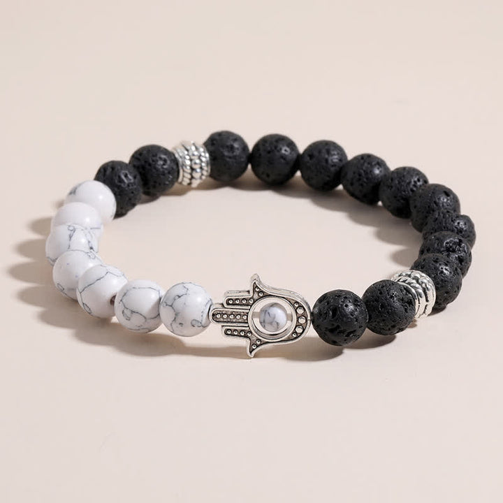 Buddha Stones Ręcznie wykonana okrągła bransoletka z ochroną dłoni Hamsa z lawy wulkanicznej - image 0