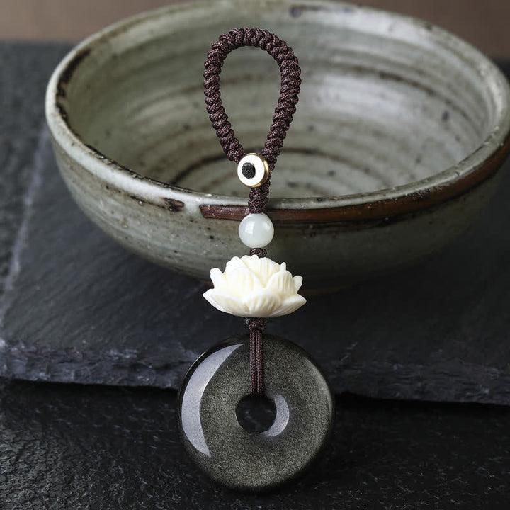 Buddha Stones Breloczki ochronne Rainbow Obsidian Lotus Peace Buckle - Lotus - Brelok z klamrą w kolorze obsydianu Golden Sheen Peace - Tęczowy obsydian (zmienia kolor pod wpływem światła) - image 0