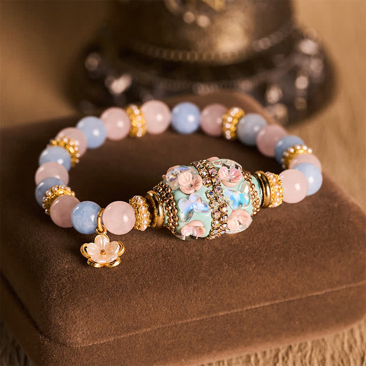 Buddha Stones Bransoletka z okrągłymi koralikami w kształcie kwiatu z różowego kwarcu, niebieskiego chalcedonu i miedzi - Kwarc różowy, chalcedon niebieski (obwód nadgarstka: 15–16 cm) - image 0