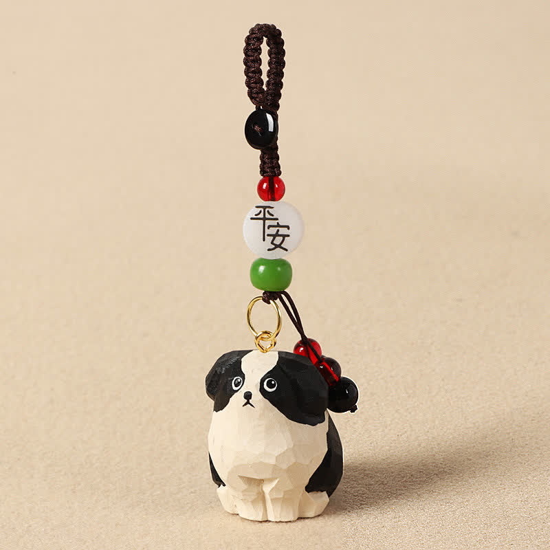 Buddha Stones Rzeźbiony drewniany pies Om Mani Padme Hum – breloki mądrości - Bezpieczny czarno-biały pies - image 1