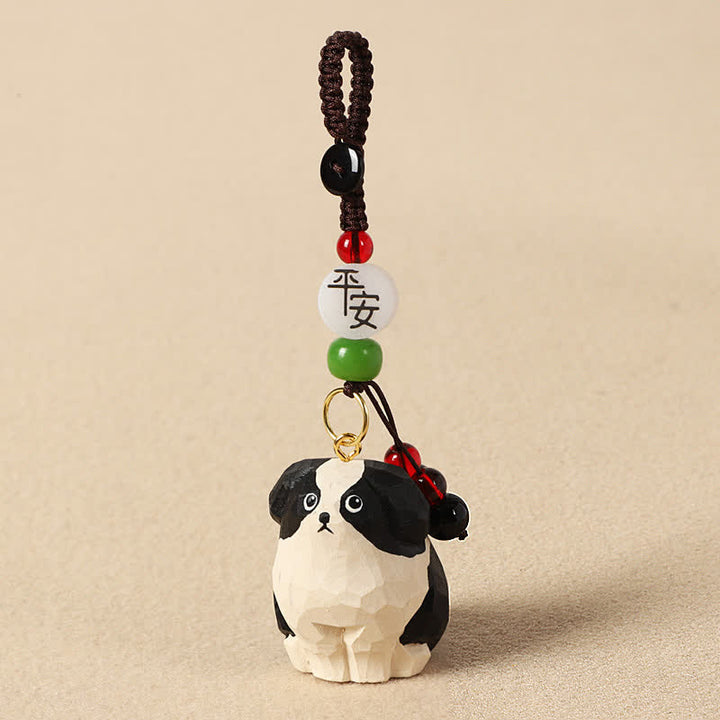 Buddha Stones Rzeźbiony drewniany pies Om Mani Padme Hum – breloki mądrości - Bezpieczny czarno-biały pies - image 1