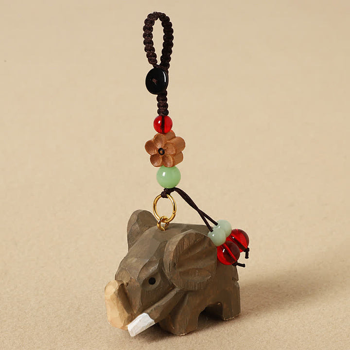 Buddha Stones Naturalne drewniane breloczki do kluczy z motywem słonia, pokoju , Om Mani Padme Hum - Kwiat śliwy słonia - image 1