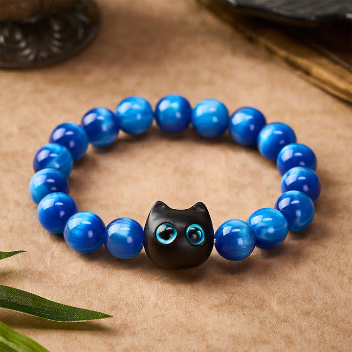 Buddha Stones Bransoletka z niebieskimi koralikami z żywicy i drewna hebanowego w kształcie kota - image 1