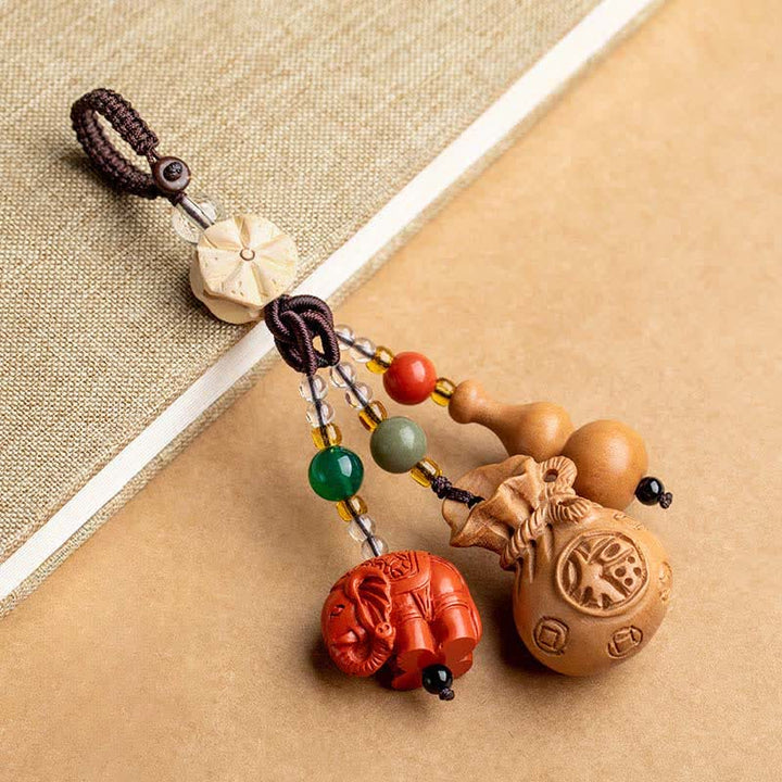 Buddha Stones Breloczki do kluczy z motywem brzoskwiniowego drewna Fu, sakiewki na pieniądze, szczęśliwy cynobrowy słoń, lotos, tykwa - Drewno brzoskwiniowe (ochrona ♥ oczyszczanie) - image 0