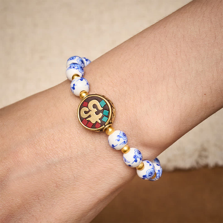Buddha Stones Bransoletka z koralików OM Compassion z niebieskiej i białej porcelany z miedzi - image 3