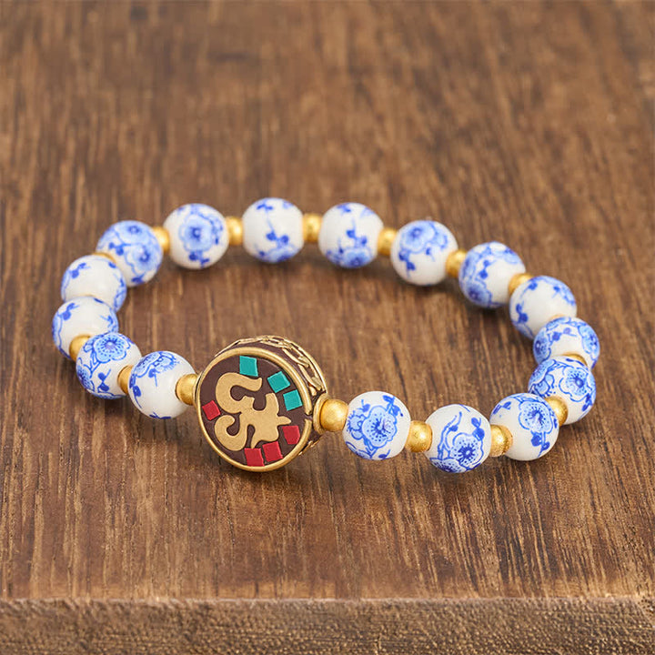 Buddha Stones Bransoletka z koralików OM Compassion z niebieskiej i białej porcelany z miedzi - image 1