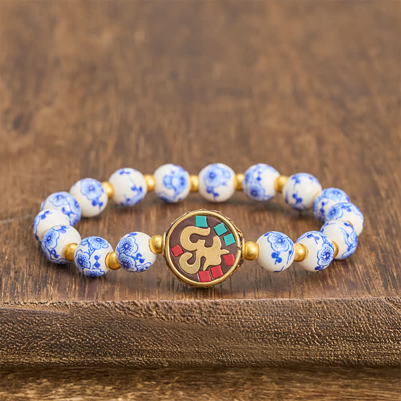 Buddha Stones Bransoletka z koralików OM Compassion z niebieskiej i białej porcelany z miedzi - OM (Uważność ♥ Połączenie) - image 0