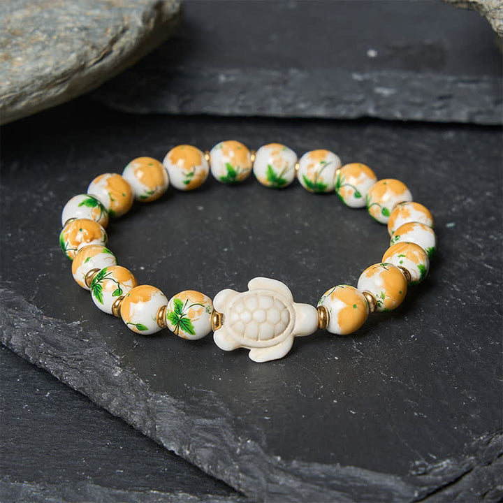 Buddha Stones Bransoletka Wealth z naturalnym, białym turkusem i wzorem żółwia - image 2