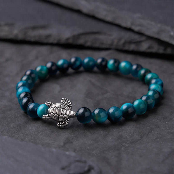 Buddha Stones Bransoletka z niebieskim tygrysim okiem i miedzianym żółwiem - image 1
