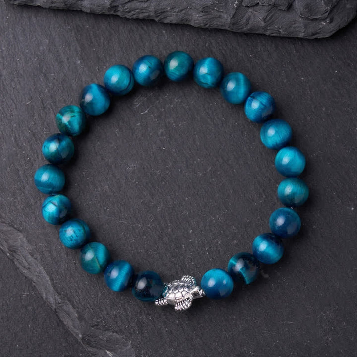 Buddha Stones Bransoletka z niebieskim tygrysim okiem i miedzianym żółwiem - image 11