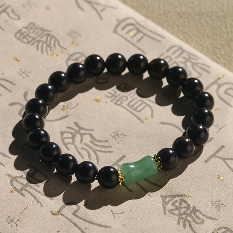Buddha Stones Bransoletka unisex z drewna hebanowego i zielonego sandału z naturalnym usłojeniem - image 1