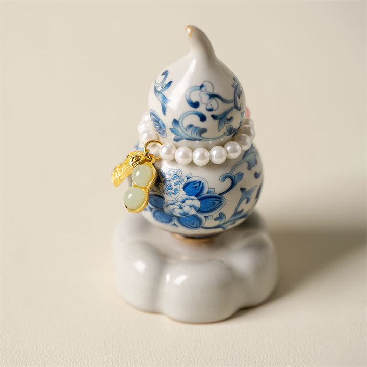 Buddha Stones Niebiesko-biała ceramiczna obrotowa tykwa Lotus Mindful Living Decor - Biała podstawa ok. 4,8 cm × 4,8 cm × 8,5 cm - image 0