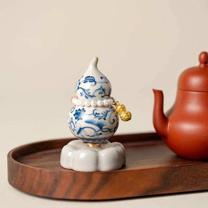 Buddha Stones Niebiesko-biała ceramiczna obrotowa tykwa Lotus Mindful Living Decor - image 1