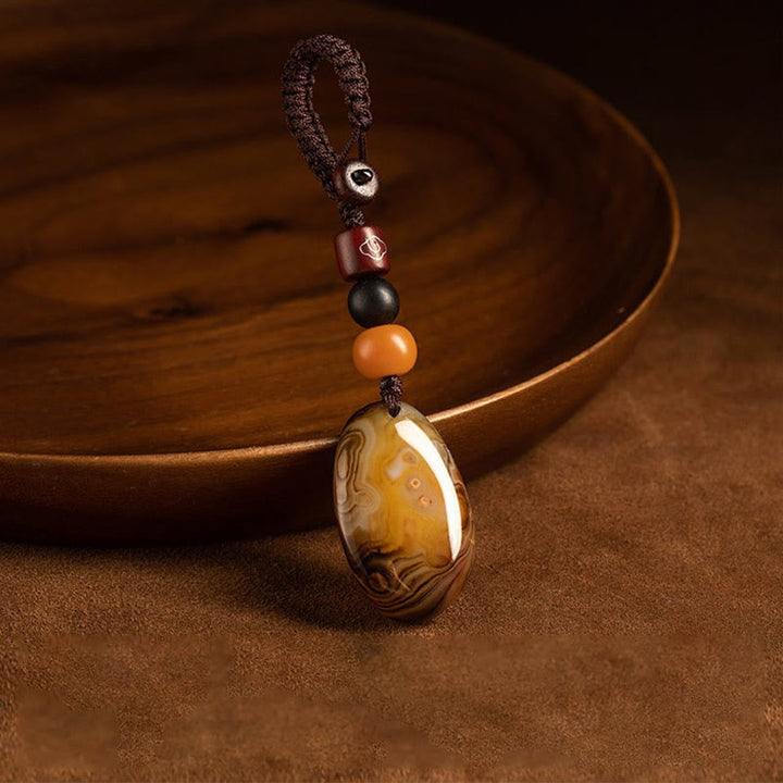 Buddha Stones Losowy Kamień Sardonyx Pozytywny Brelok