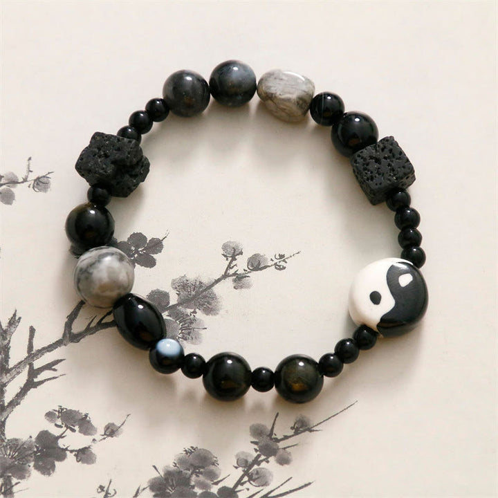 Bransoletka ochronna z Buddha Stones z czarnego onyksu i koralikami z jaspisu Picasso Yin Yang