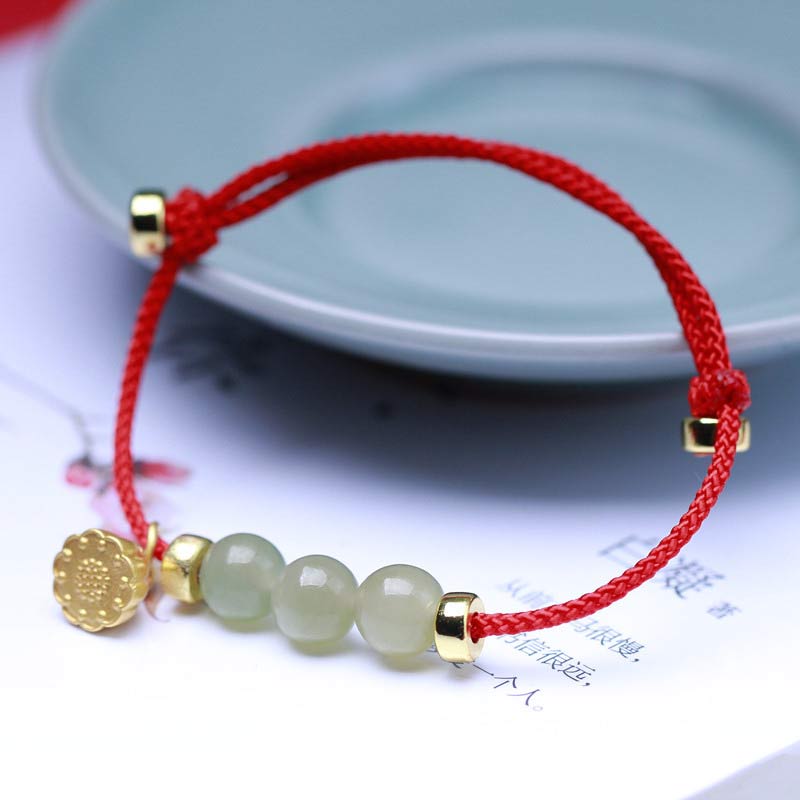 Bransoletka z naturalnego jadeitu i nasion lotosu z czerwonej nici Buddha Stones