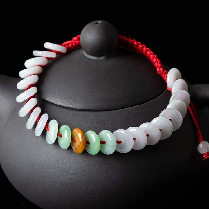 Bransoletka z okrągłym jadeitem i czerwonymi sznurkami Buddha Stones