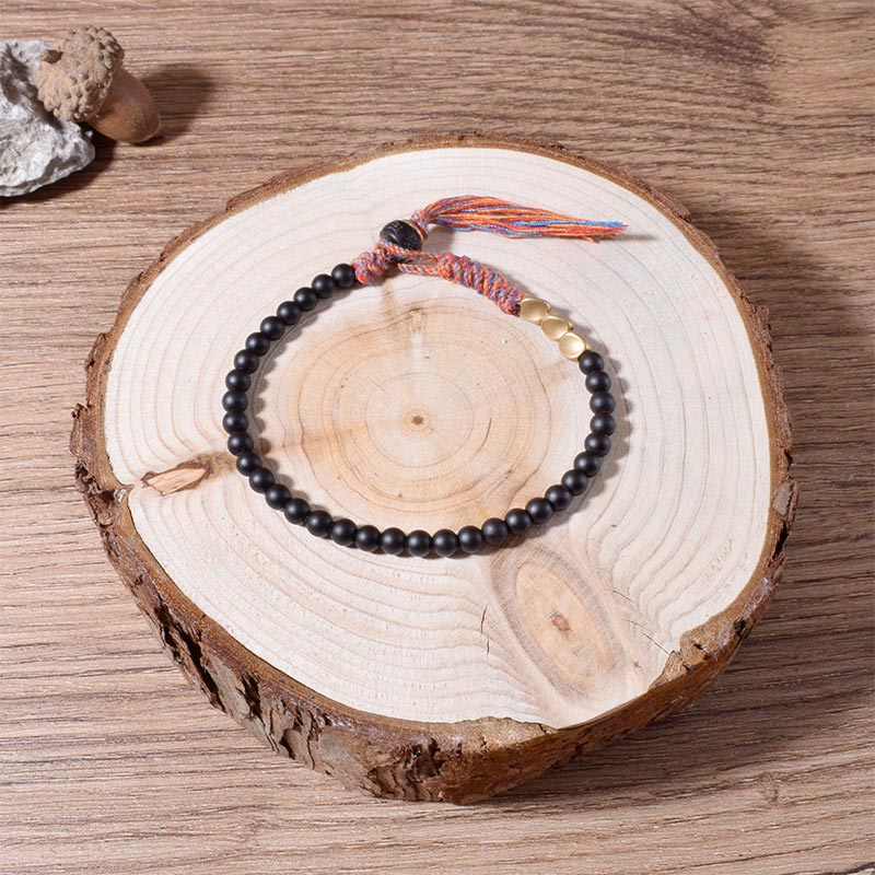 Bransoletka z frędzlami z Buddha Stones wykonana ręcznie z tybetańskiego czarnego onyksu
