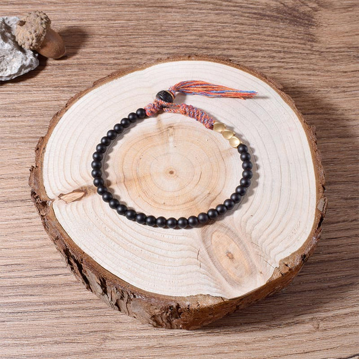 Bransoletka z frędzlami z Buddha Stones wykonana ręcznie z tybetańskiego czarnego onyksu