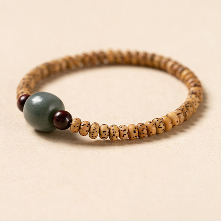 Bransoletka mądrości z małych liści drzewa sandałowego z nasion Bodhi w kolorze czerwonym z Buddha Stones