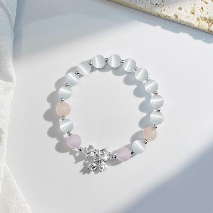 Bransoletka z zawieszką w kształcie rozety z Buddha Stones , kociego oka i lawendowego ametystu