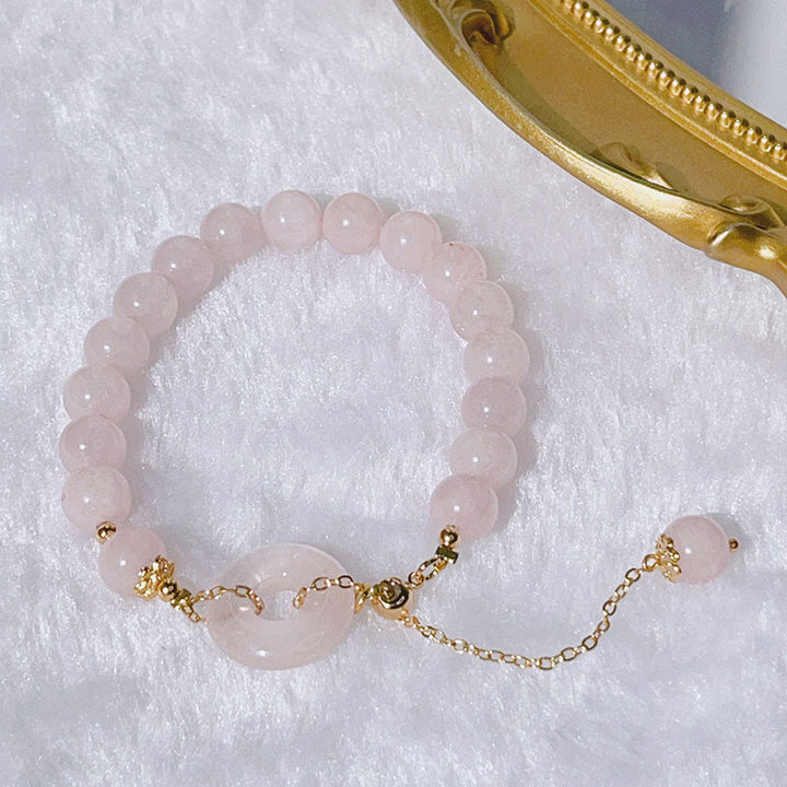 Bransoletka z naturalnego różowego kryształu Buddha Stones z klamrą i zawieszką Love Charm