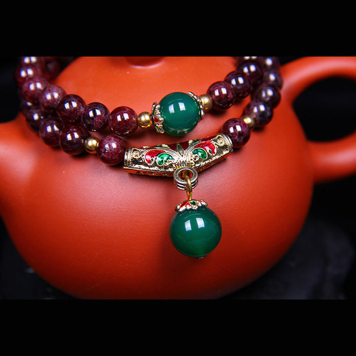 Bransoletka z naturalnego granatu i Buddha Stones