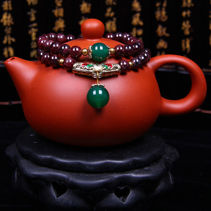 Bransoletka z naturalnego granatu i Buddha Stones