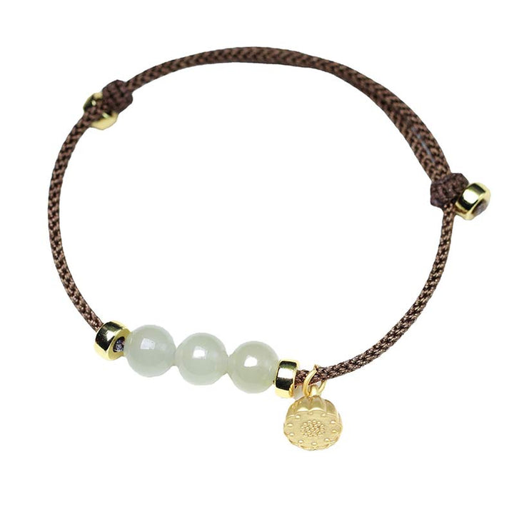Bransoletka z naturalnego jadeitu i nasion lotosu z czerwonej nici Buddha Stones
