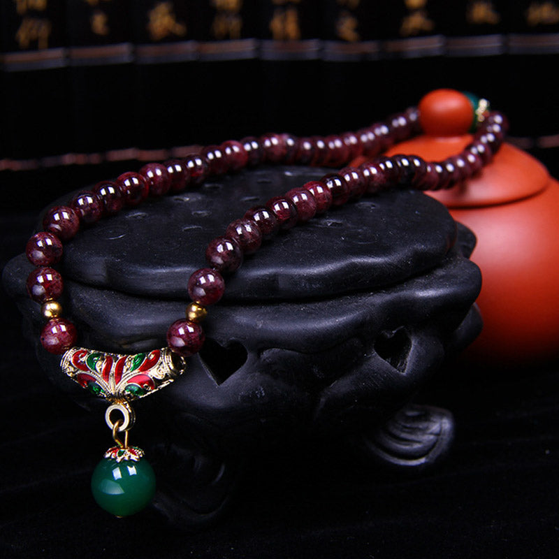 Bransoletka z naturalnego granatu i Buddha Stones