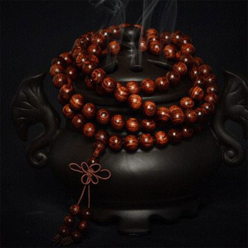 Bransoletka z ciepłego drewna palisandrowego z Buddha Stones (losowy typ)