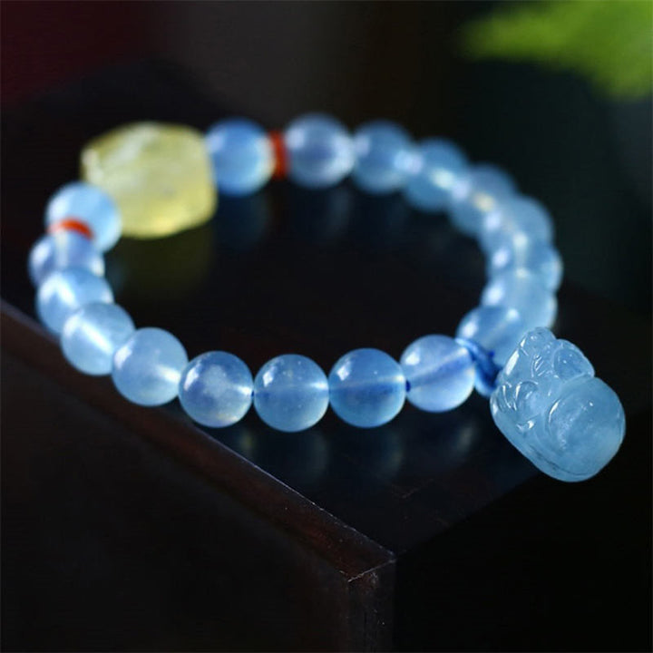 Bransoletka z naturalnego bursztynu i akwamarynu PiXiu Peace Healing Charm