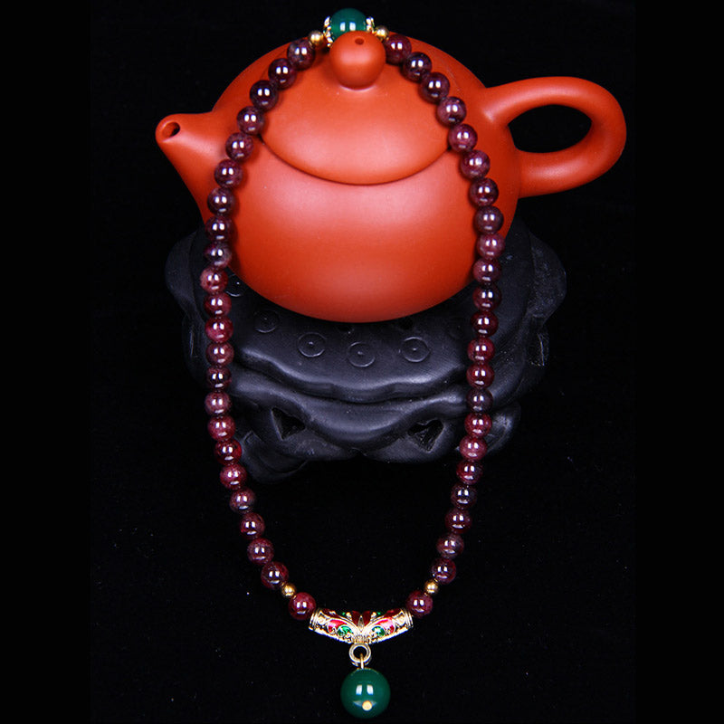Bransoletka z naturalnego granatu i Buddha Stones