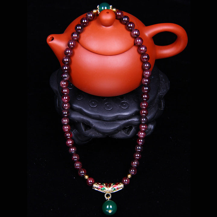 Bransoletka z naturalnego granatu i Buddha Stones