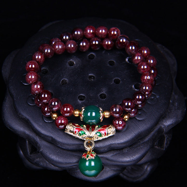 Bransoletka z naturalnego granatu i Buddha Stones
