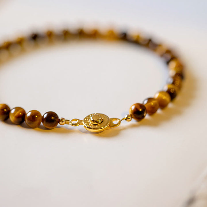 Bransoletka ochronna z Buddha Stones 14K pozłacane naturalne tygrysie oko z kamieniami odwagi