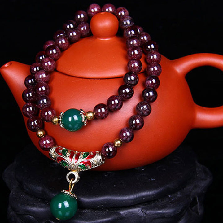 Bransoletka z naturalnego granatu i Buddha Stones